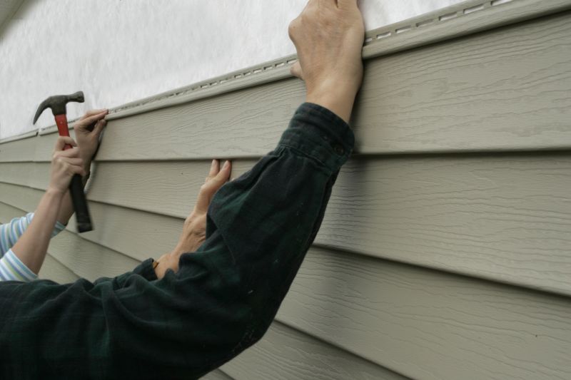 Expert Vinyl Siding Repair in Action